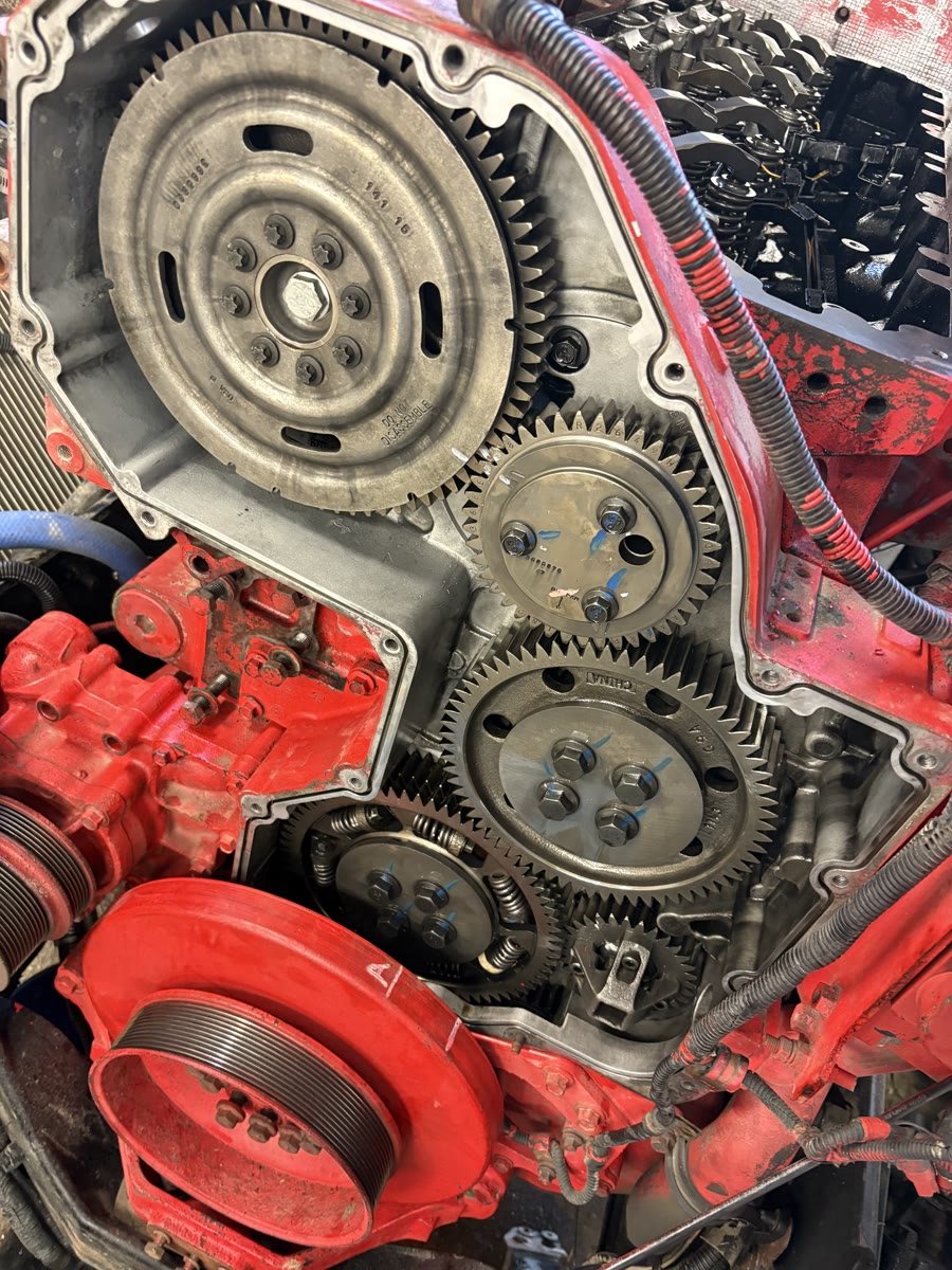 Diesel engine rebuild showing timing gears and flywheel at Mazdock Mechanical shop in Agassiz BC